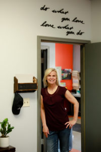 Michelle Sukow smiles in her office. She's excited to welcome you to her new mindset group, My Lane Too.